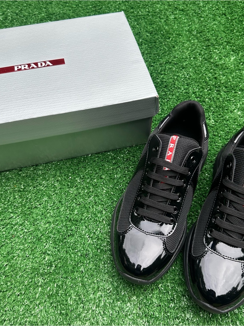 Prada Men’s Black Patent & Mesh Low-Top Sneakers with Red Logo